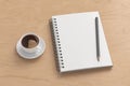 Notebook mockup. Blank notebook, coffee and pencil. Spiral notepad on wooden desk Royalty Free Stock Photo