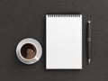 Notebook mockup. Blank workplace notebook. Spiral notepad on dark wooden desk Royalty Free Stock Photo