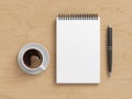 Notebook mockup. Blank workplace notebook. Spiral notepad on wooden desk Royalty Free Stock Photo