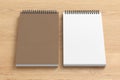 Notebook mockup. Closed and open blank notebook brown paper cover. Spiral notepad on wooden background Royalty Free Stock Photo
