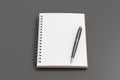 Notebook mockup. Opened blank notebook and pen. Spiral notepad on gray background