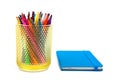 Notebook and multicolored markers on a white background Royalty Free Stock Photo