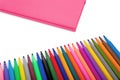 Notebook and multicolored markers on a white background Royalty Free Stock Photo