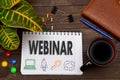 Notebook with a notes WEBINAR on the office table with tools Royalty Free Stock Photo