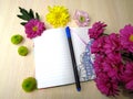 Notebook is open for inscription with flowers