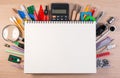 Notebook over school supplies or office supplies on school table Royalty Free Stock Photo