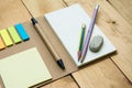 Notebook paper, post it and pen top view on wood pallet Royalty Free Stock Photo