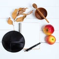 Notebook, pen and black kipa on a white wooden background, top view. Jewish New Year, Rosh Hashanah