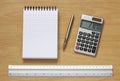 Notebook pen calculator and ruler on desk Royalty Free Stock Photo