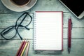 Notebook,pen,cellphone, glasses,pencil color and coffee Royalty Free Stock Photo