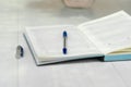 Notebook and pen close-up. Notebook and pen lie on the table Royalty Free Stock Photo