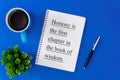 Notebook, pen and coffee mug on blue background. Royalty Free Stock Photo