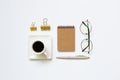 Notebook, pen, cup of coffee, glasses, clip on white background Royalty Free Stock Photo