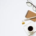 Notebook, pen, cup of coffee, glasses, clip on white background Royalty Free Stock Photo