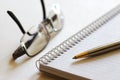 Notebook, Pen and Eyeglasses Royalty Free Stock Photo