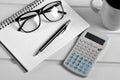 Notebook pen eyeglasses and calculator Royalty Free Stock Photo
