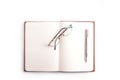 Notebook with pen and glasses.