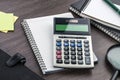 Notebook, pen and Magnifier with Calculator on the desk Royalty Free Stock Photo