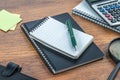 Notebook, pen and Magnifier with Calculator on the desk Royalty Free Stock Photo