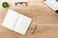 Notebook, pen, succulent and menology on marble table Royalty Free Stock Photo
