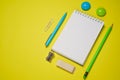 Notebook and pen on a yellow background. Top view with copy space. Stationery Royalty Free Stock Photo