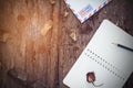 Notebook,pencil,glasses,airmail and dried roses Royalty Free Stock Photo
