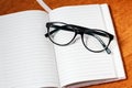 Notebook, pencil and glasses Royalty Free Stock Photo