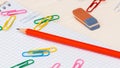 Notebook pencil paper clips on a desk Royalty Free Stock Photo