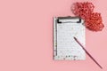 notebook with a pencil for writing a greeting text and two rattan hearts are symbols of love Royalty Free Stock Photo