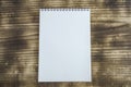 A notebook placed on a wooden table