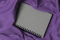 Notebook on purple fabric ,Notebook is gray,Vintage notebook cover