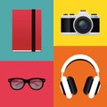 Notebook, retro camera, headphones and hipster glasses.