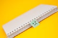 Notebook with a sad face tab as a marker, pointing to an issue that needs attention Royalty Free Stock Photo