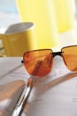 Notebook, sunglasses and pen Royalty Free Stock Photo