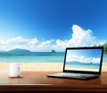 notebook on table and beach Royalty Free Stock Photo