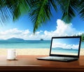 Notebook on table and beach Royalty Free Stock Photo