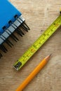 Notebook, tape measure and a pencil Royalty Free Stock Photo