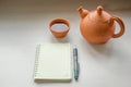 A notebook and a teaset