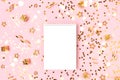 Notebook template on a pink background with gold confetti