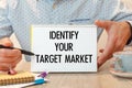 Notebook with text - Identify Your Target Market - near office supplies