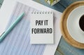 Notebook with text PAY IT FORWARD . Diagram Royalty Free Stock Photo