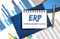 Notebook with Toolls and Notes about ERP on business chart ,concept Royalty Free Stock Photo