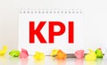 Notebook with Toolls and Notes about KPI,concept Royalty Free Stock Photo