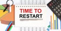 Notebook with Tools , charts and Notes with text TIME TO RESTART Royalty Free Stock Photo