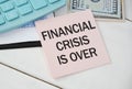 Notebook with Tools and Notes about FINANCIAL CRISIS IS OVER. Royalty Free Stock Photo