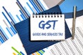 Notebook with Tools and Notes about GST Goods and Services Tax ,concept Royalty Free Stock Photo