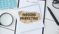 Notebook with Tools and Notes About Inbound Marketing Royalty Free Stock Photo
