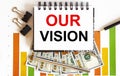 Notebook with Tools and Notes about OUR VISION ,business concept Royalty Free Stock Photo