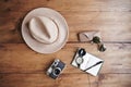 Notebook, vintage camera, compass, sunglasses and hat. Royalty Free Stock Photo