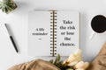 Notebook with wisdom quote and coffee cup. Royalty Free Stock Photo